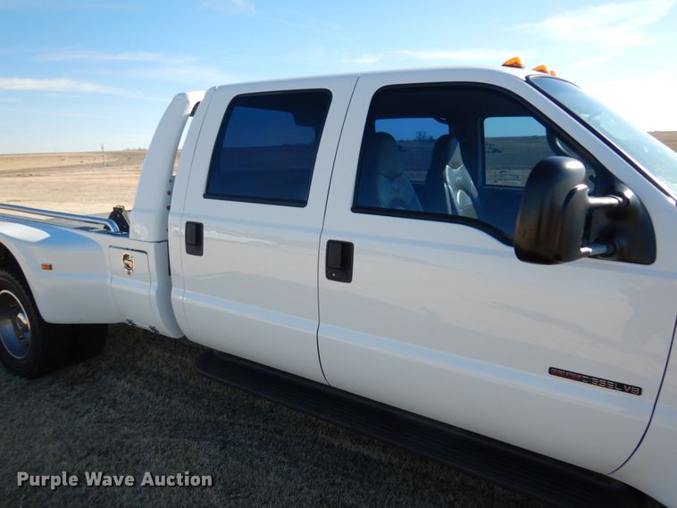 image for item DF7376 1999 Ford F450 Super Duty XLT Crew Cab flatbed truck