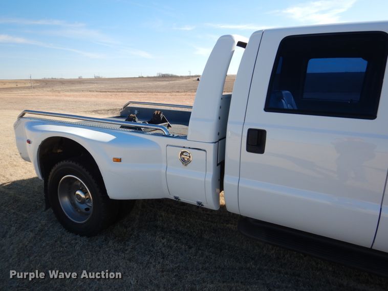 image for item DF7376 1999 Ford F450 Super Duty XLT Crew Cab flatbed truck