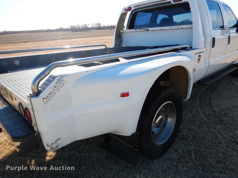 image for item DF7376 1999 Ford F450 Super Duty XLT Crew Cab flatbed truck