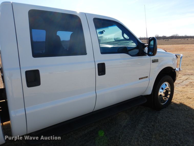 image for item DF7376 1999 Ford F450 Super Duty XLT Crew Cab flatbed truck