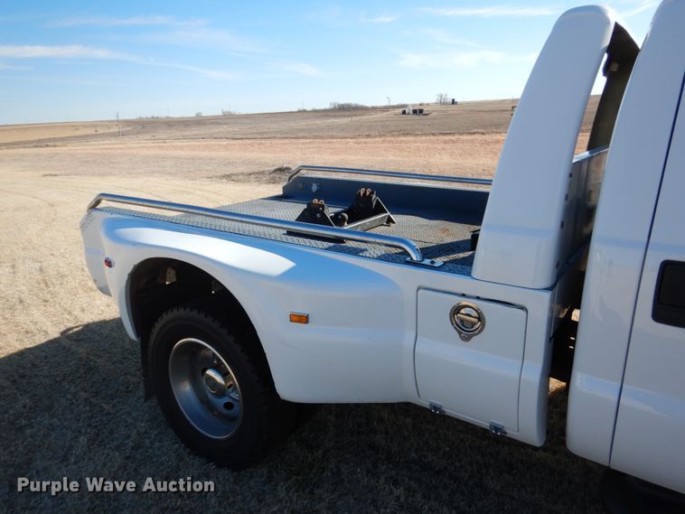 image for item DF7376 1999 Ford F450 Super Duty XLT Crew Cab flatbed truck