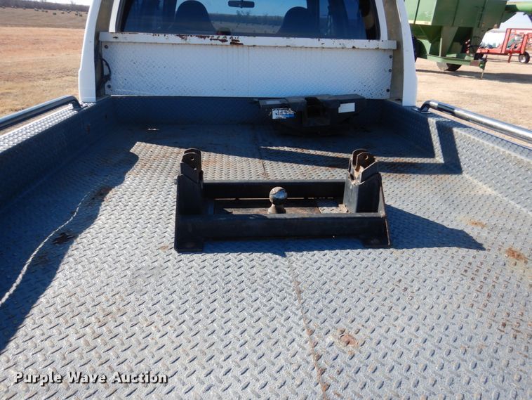 image for item DF7376 1999 Ford F450 Super Duty XLT Crew Cab flatbed truck