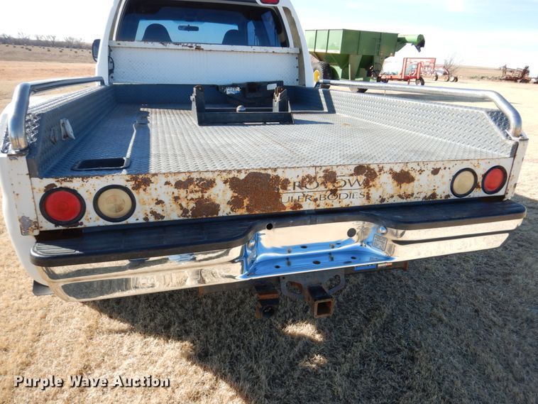 image for item DF7376 1999 Ford F450 Super Duty XLT Crew Cab flatbed truck