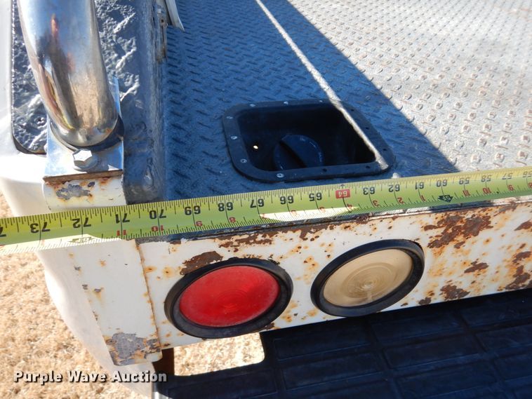 image for item DF7376 1999 Ford F450 Super Duty XLT Crew Cab flatbed truck