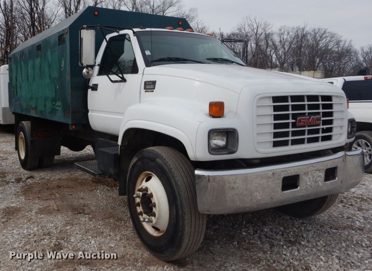 image for item DH5093 1999 GMC C6500 chip bed truck