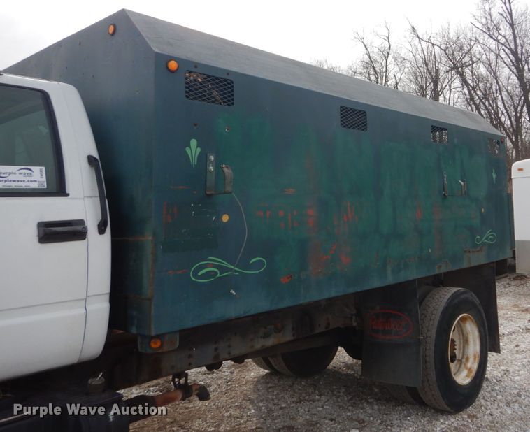 image for item DH5093 1999 GMC C6500 chip bed truck