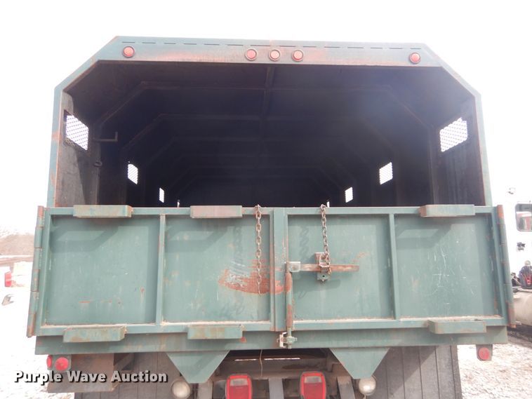 image for item DH5093 1999 GMC C6500 chip bed truck