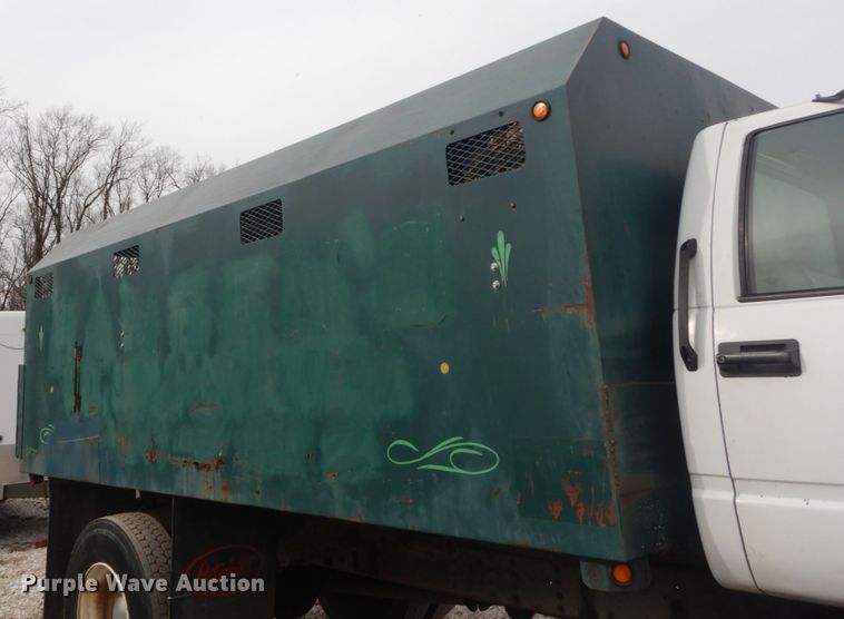 image for item DH5093 1999 GMC C6500 chip bed truck