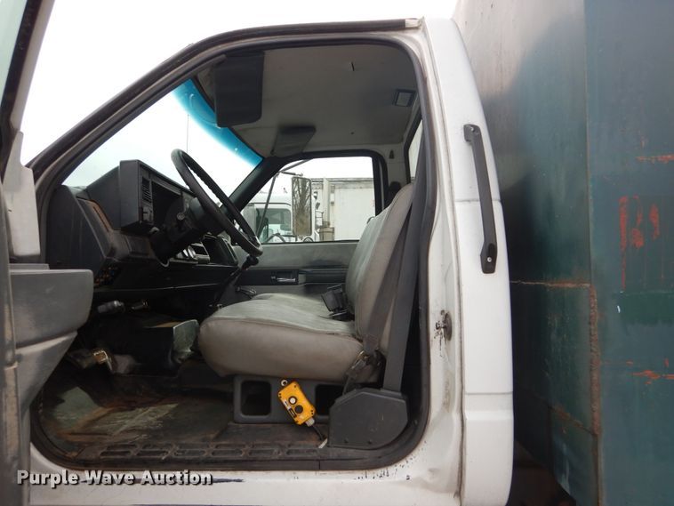 image for item DH5093 1999 GMC C6500 chip bed truck