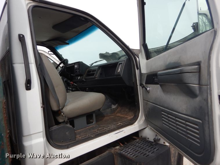 image for item DH5093 1999 GMC C6500 chip bed truck