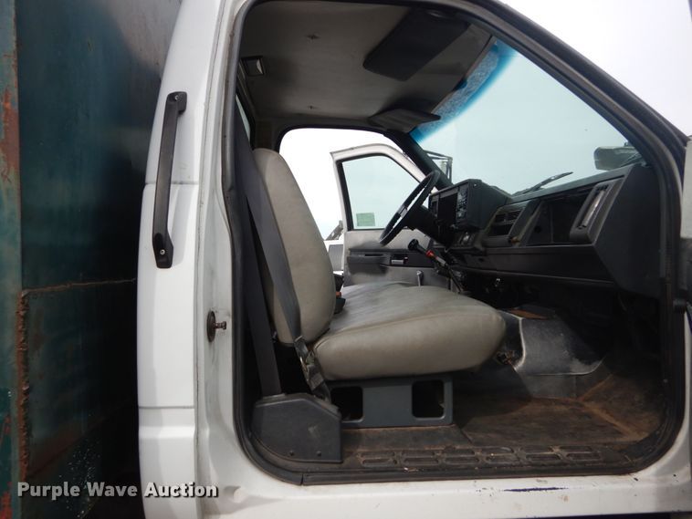 image for item DH5093 1999 GMC C6500 chip bed truck