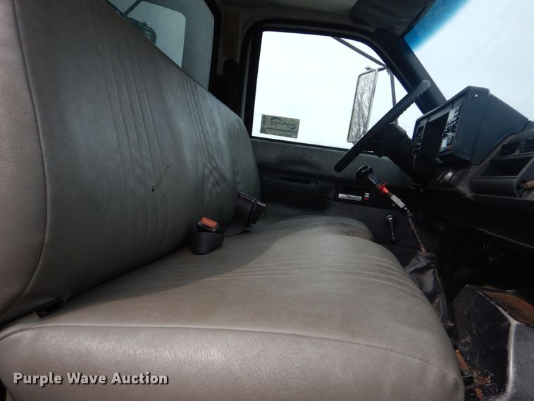 image for item DH5093 1999 GMC C6500 chip bed truck