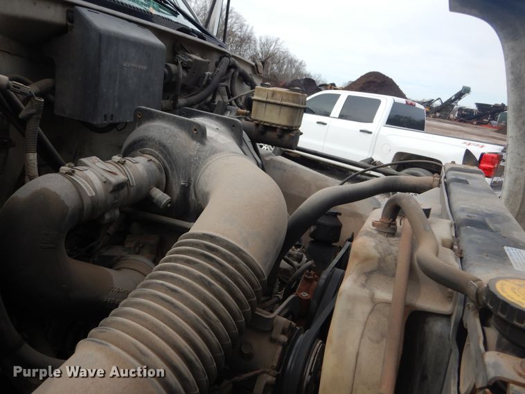 image for item DH5093 1999 GMC C6500 chip bed truck