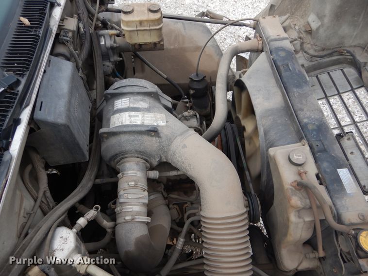 image for item DH5093 1999 GMC C6500 chip bed truck