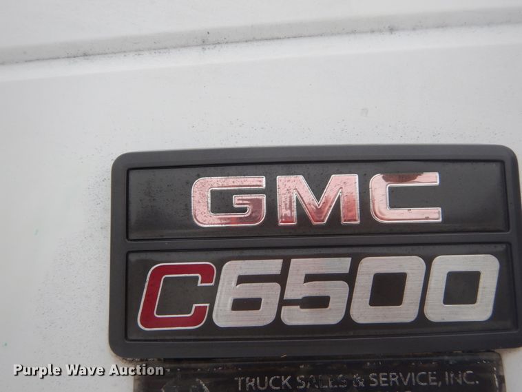 image for item DH5093 1999 GMC C6500 chip bed truck