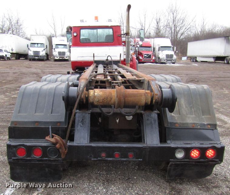 image for item DH8453 1999 Mack DM600 roll-off container truck