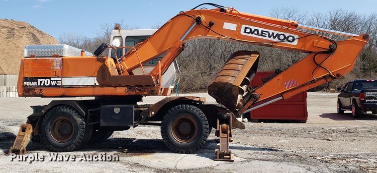 image for item GO9294 1999 Daewoo Solar 170W-III rubber tired excavator