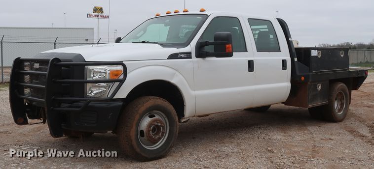 image for item DG7152 2014 Ford F350 Super Duty XLT  Crew Cab flatbed pickup truck