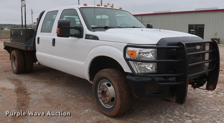 image for item DG7152 2014 Ford F350 Super Duty XLT  Crew Cab flatbed pickup truck