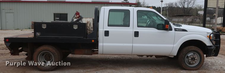 image for item DG7152 2014 Ford F350 Super Duty XLT  Crew Cab flatbed pickup truck