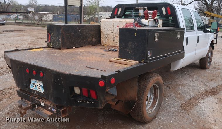 image for item DG7152 2014 Ford F350 Super Duty XLT  Crew Cab flatbed pickup truck