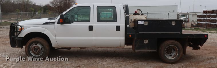 image for item DG7152 2014 Ford F350 Super Duty XLT  Crew Cab flatbed pickup truck