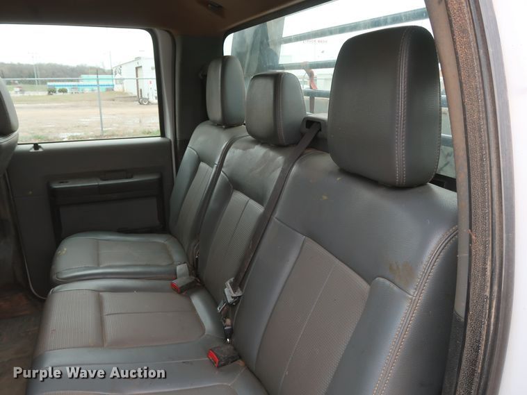 image for item DG7152 2014 Ford F350 Super Duty XLT  Crew Cab flatbed pickup truck