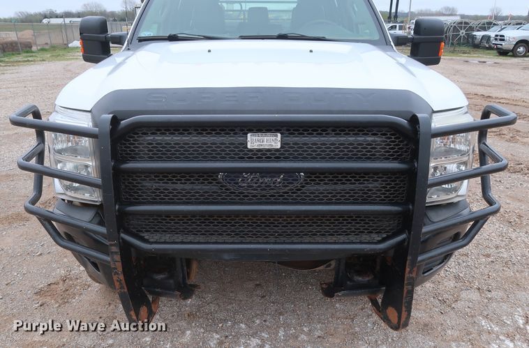 image for item DG7152 2014 Ford F350 Super Duty XLT  Crew Cab flatbed pickup truck
