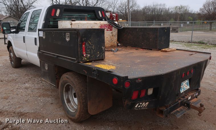 image for item DG7152 2014 Ford F350 Super Duty XLT  Crew Cab flatbed pickup truck