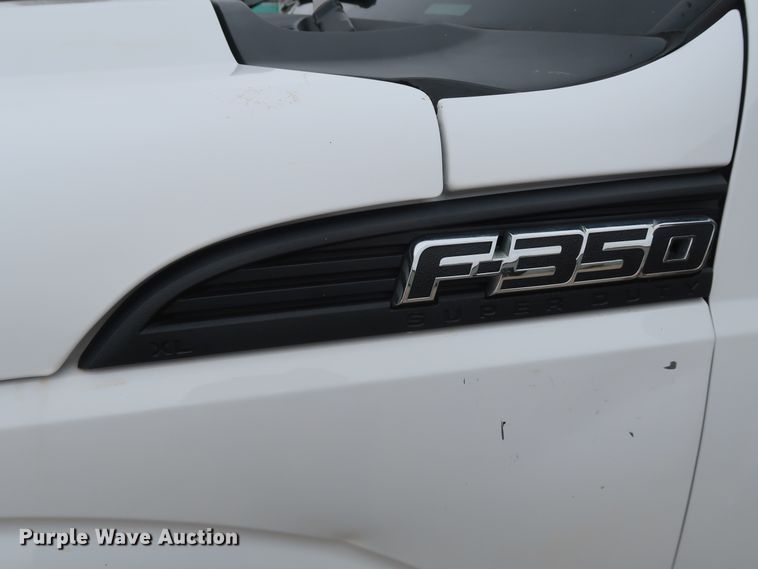 image for item DG7152 2014 Ford F350 Super Duty XLT  Crew Cab flatbed pickup truck