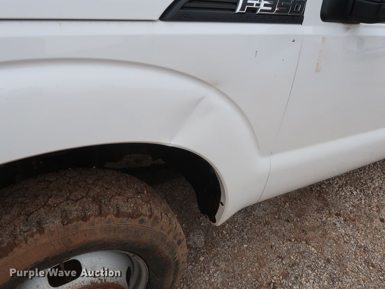 image for item DG7152 2014 Ford F350 Super Duty XLT  Crew Cab flatbed pickup truck