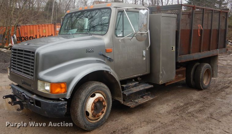 image for item GB9868 1999 International 4700 flat dump bed truck