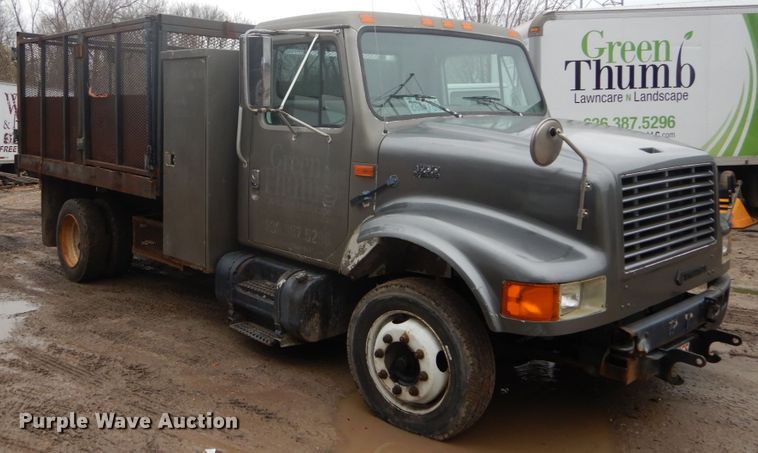 image for item GB9868 1999 International 4700 flat dump bed truck