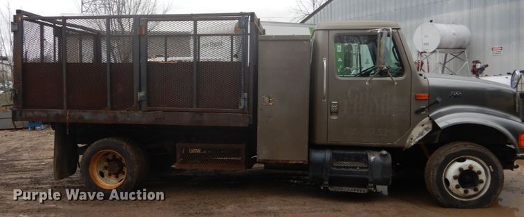 image for item GB9868 1999 International 4700 flat dump bed truck