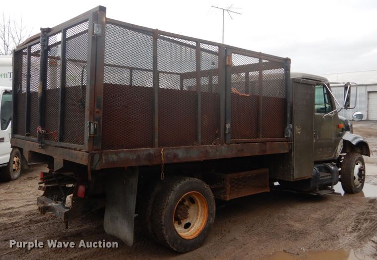 image for item GB9868 1999 International 4700 flat dump bed truck