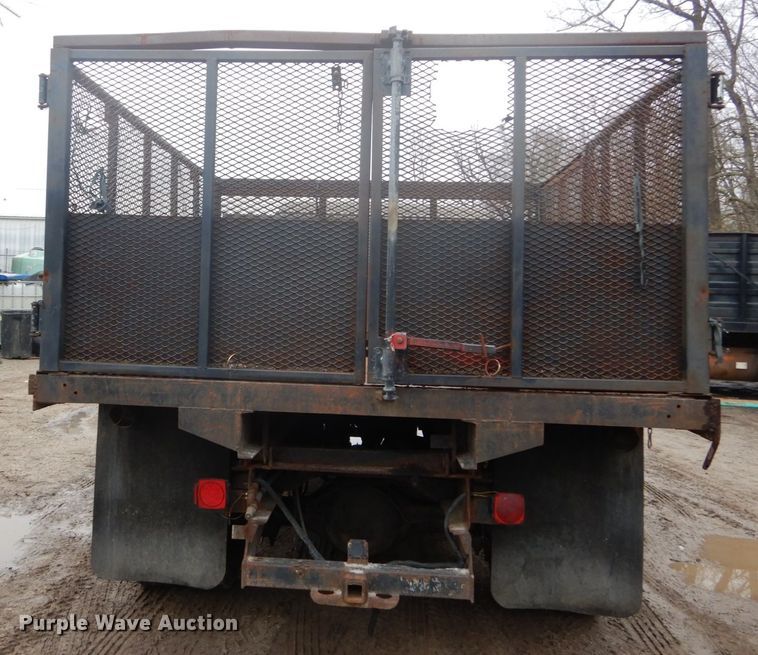 image for item GB9868 1999 International 4700 flat dump bed truck
