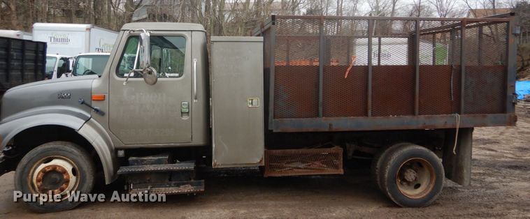 image for item GB9868 1999 International 4700 flat dump bed truck