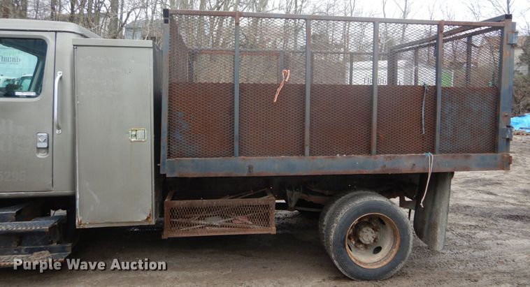 image for item GB9868 1999 International 4700 flat dump bed truck