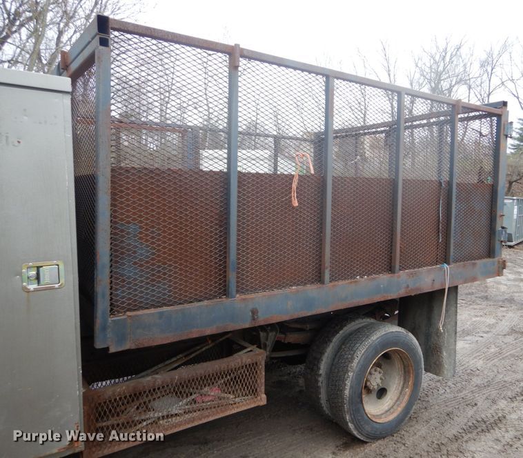 image for item GB9868 1999 International 4700 flat dump bed truck