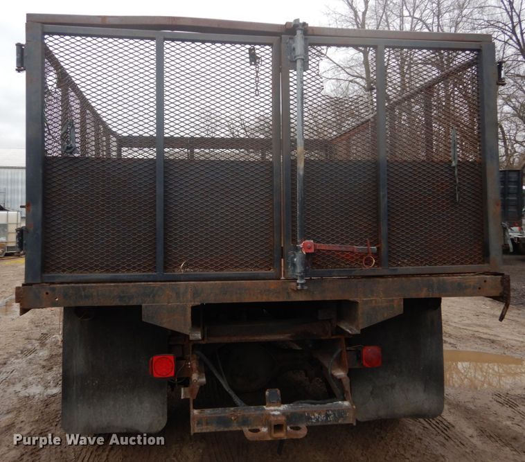 image for item GB9868 1999 International 4700 flat dump bed truck