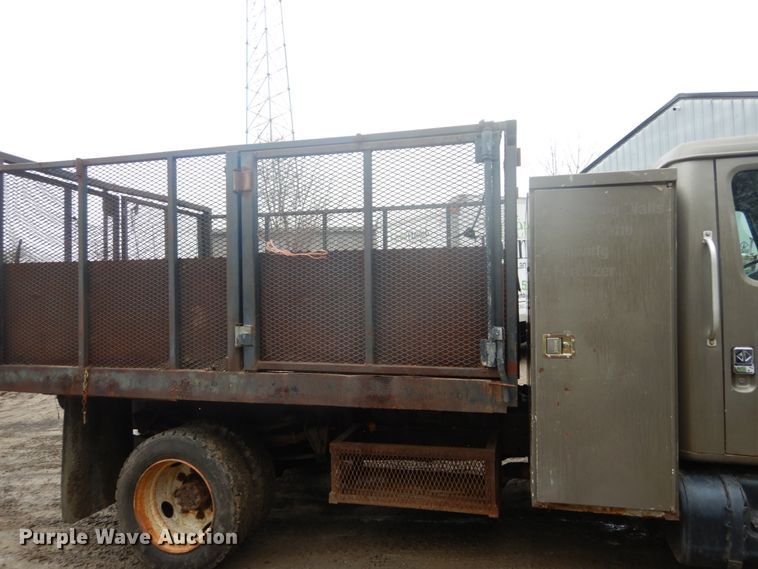 image for item GB9868 1999 International 4700 flat dump bed truck