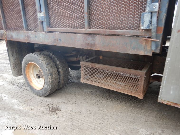 image for item GB9868 1999 International 4700 flat dump bed truck