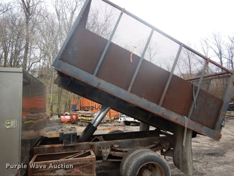 image for item GB9868 1999 International 4700 flat dump bed truck