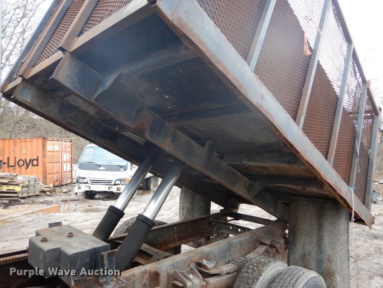 image for item GB9868 1999 International 4700 flat dump bed truck