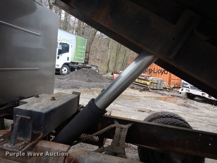 image for item GB9868 1999 International 4700 flat dump bed truck