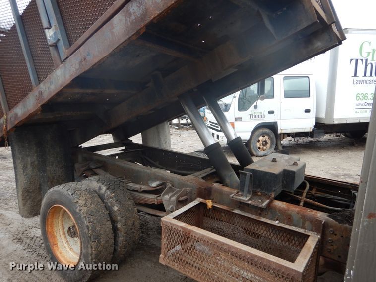 image for item GB9868 1999 International 4700 flat dump bed truck