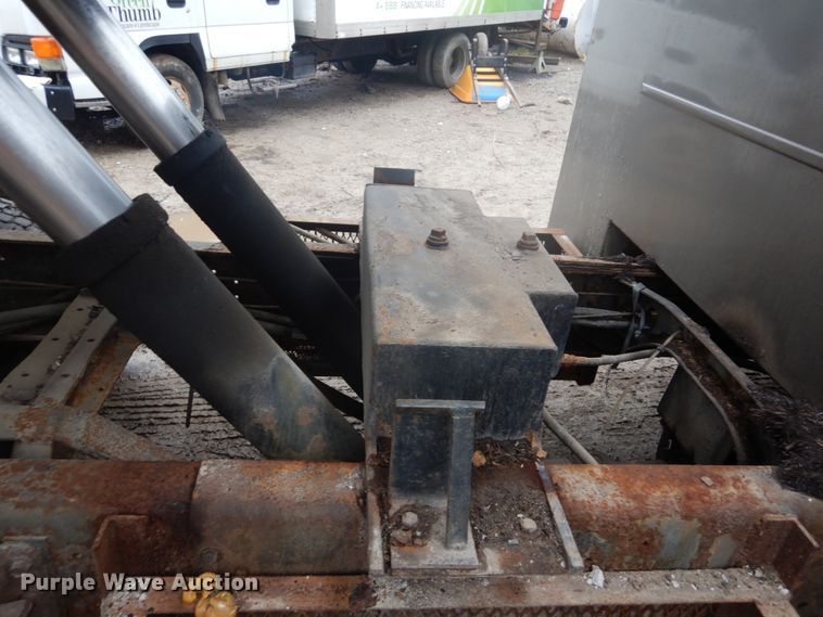 image for item GB9868 1999 International 4700 flat dump bed truck