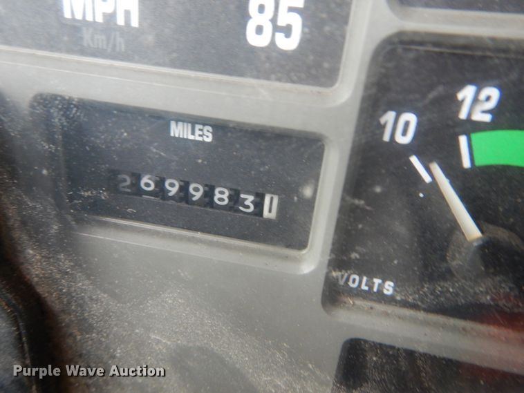 image for item GB9868 1999 International 4700 flat dump bed truck