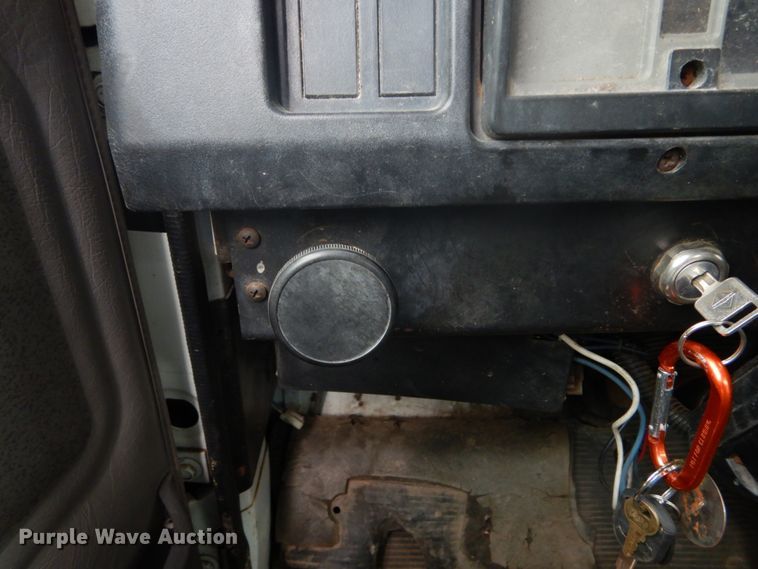 image for item GB9868 1999 International 4700 flat dump bed truck