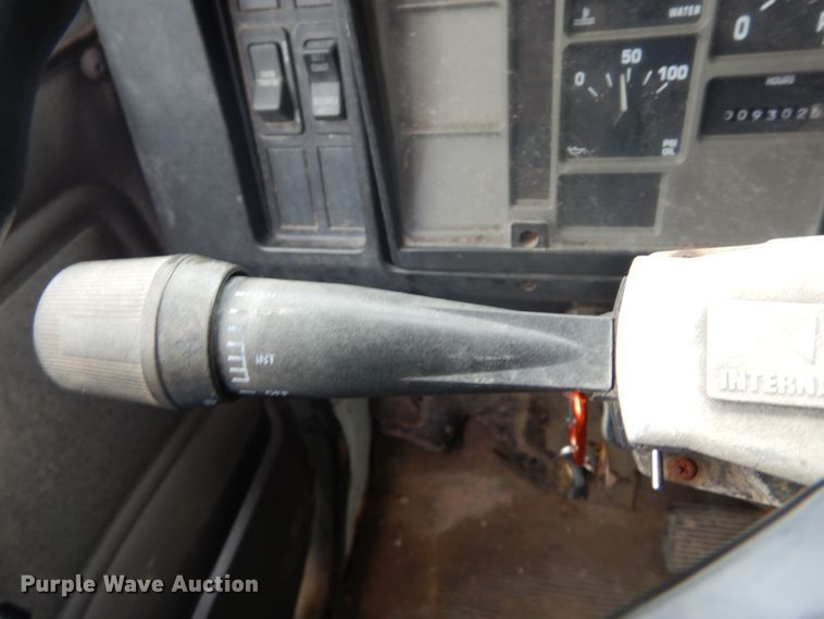 image for item GB9868 1999 International 4700 flat dump bed truck